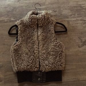 Fur vest, buttons at the bottom of vest.